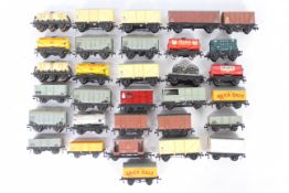 Hornby Dublo - A siding of 30 unboxed Hornby Dublo OO gauge wagons and tank wagons.