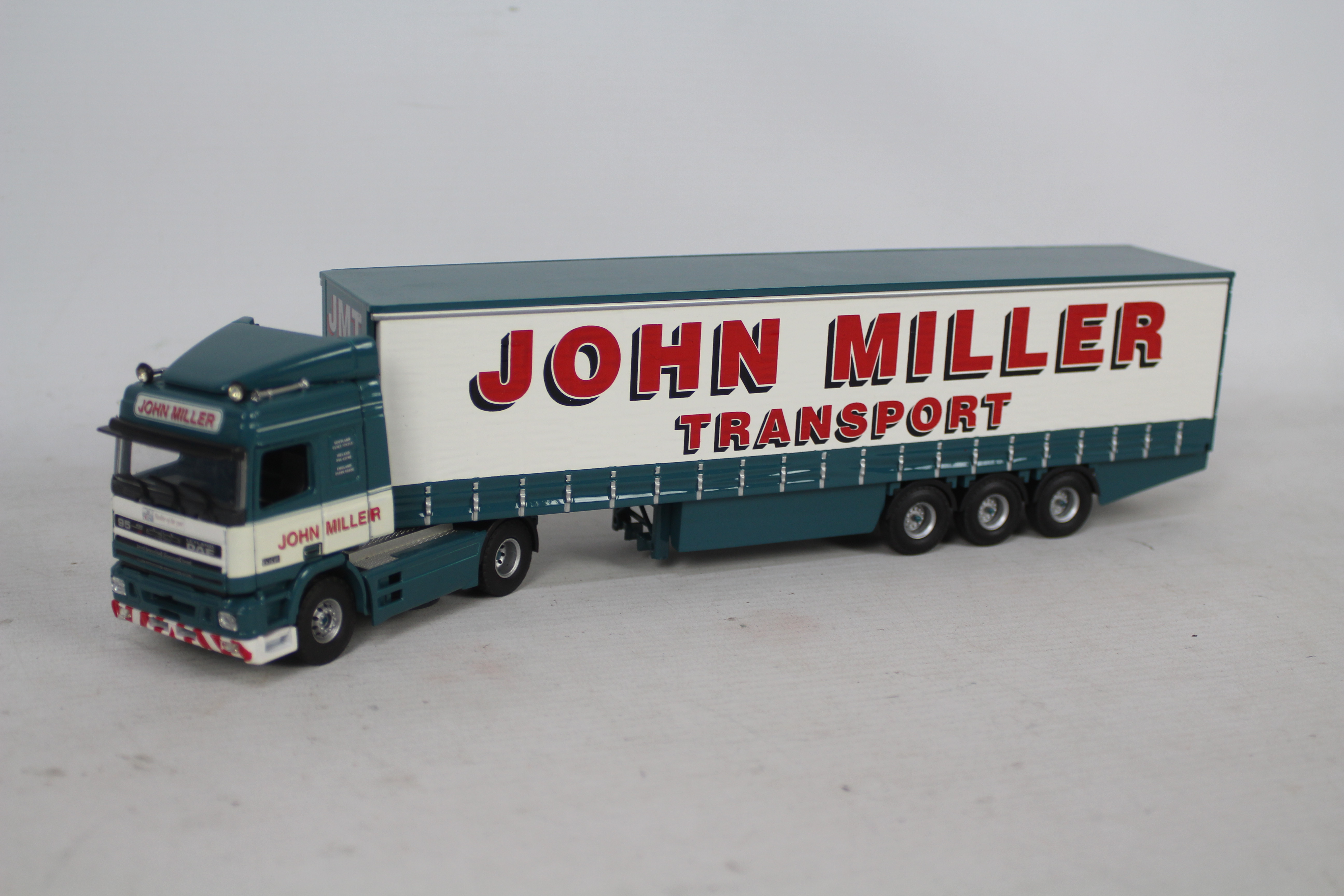 Tekno - A boxed Leyland DAF 95 Curtainsider in John Miller Transport livery in 1:50 scale. - Image 2 of 3
