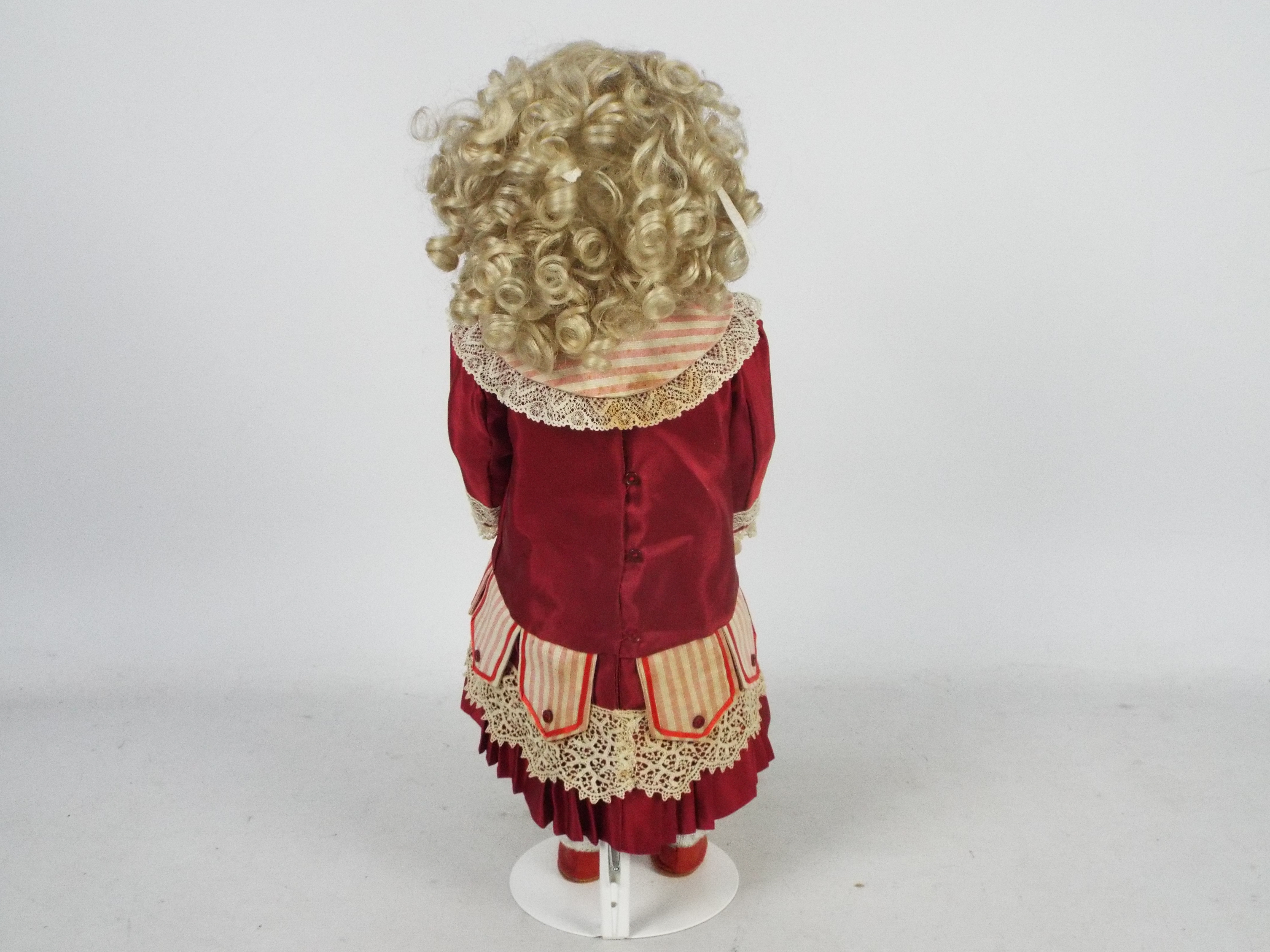 Bru Jne - A reproduction of a Bru Jne bisque head doll on stand. - Image 8 of 13