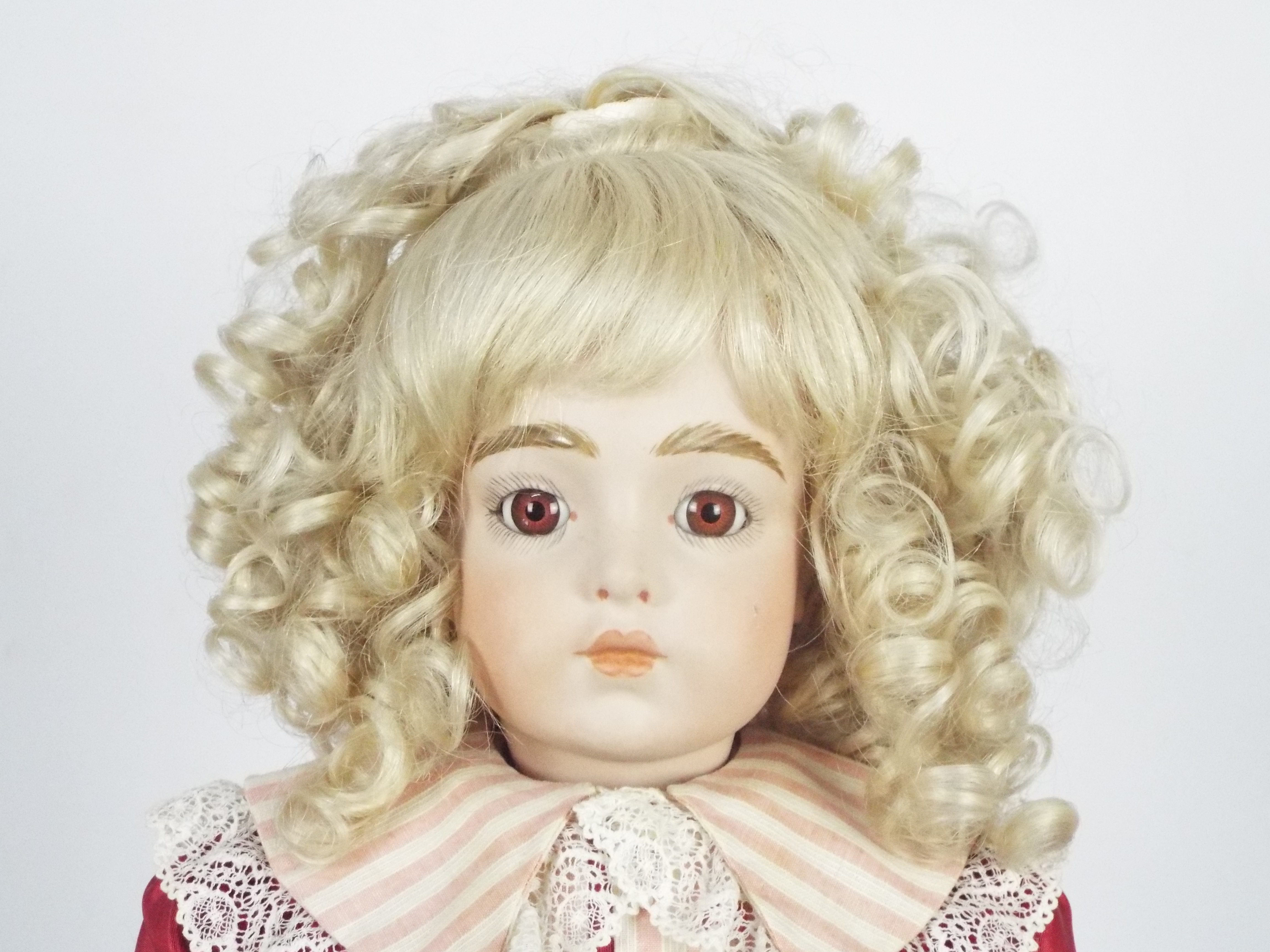 Bru Jne - A reproduction of a Bru Jne bisque head doll on stand. - Image 2 of 13