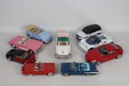 Danbury Mint, Maisto, Others - Nine diecast and plastic model cars in various scales.