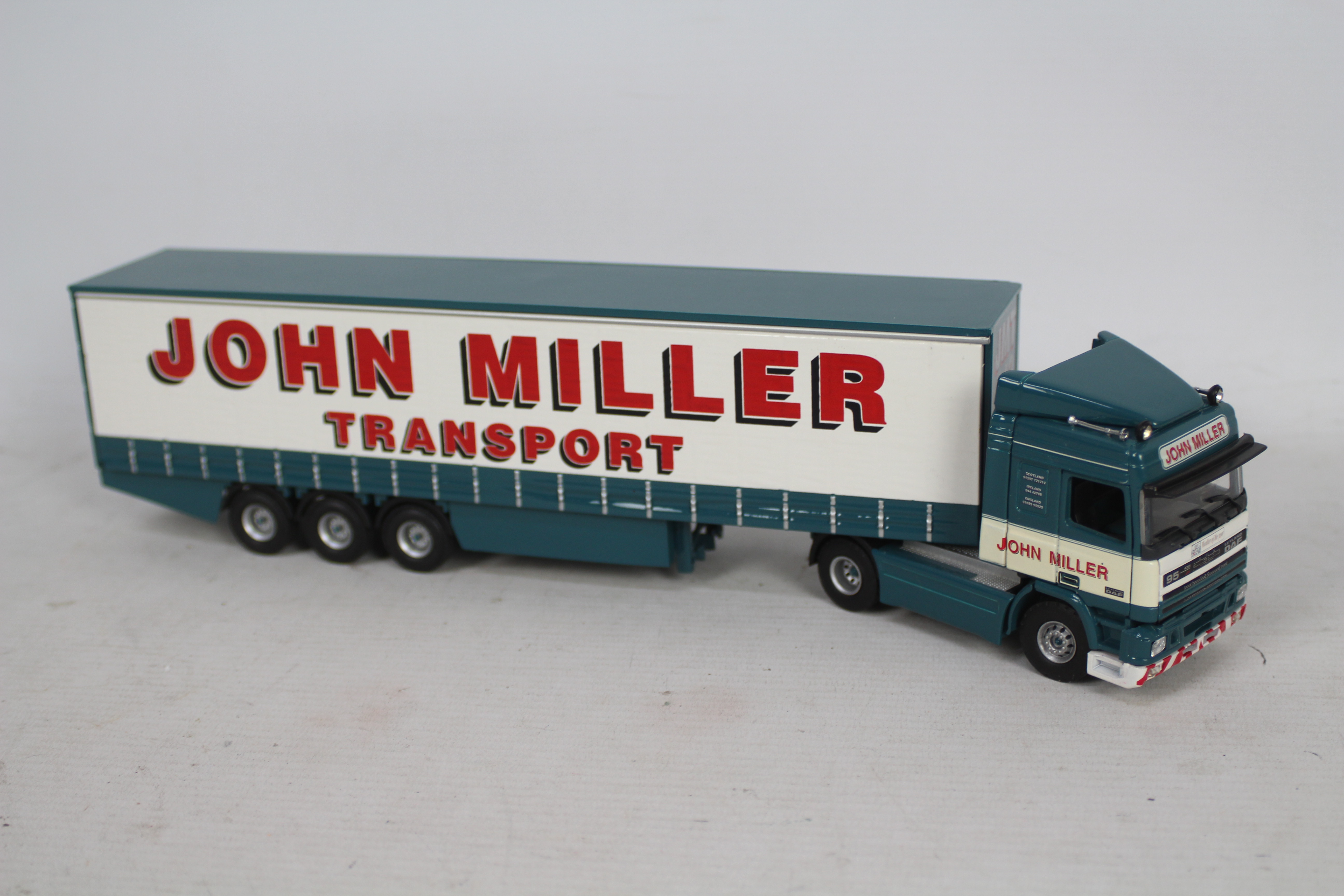 Tekno - A boxed Leyland DAF 95 Curtainsider in John Miller Transport livery in 1:50 scale. - Image 3 of 3