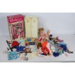 Sindy - A boxed Sindy wardrobe containing two Tressy dolls and a selection of Sindy and similar