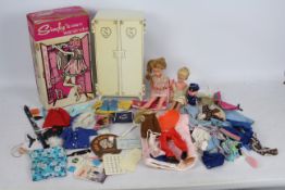 Sindy - A boxed Sindy wardrobe containing two Tressy dolls and a selection of Sindy and similar
