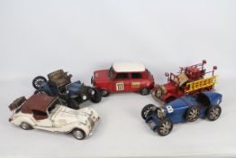 Five modern tinplate decorative model vehicles.