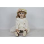 Jules Nicholas Steiner - A reproduction bisque headed doll of a 'Jules Nicholas Steiner' doll.