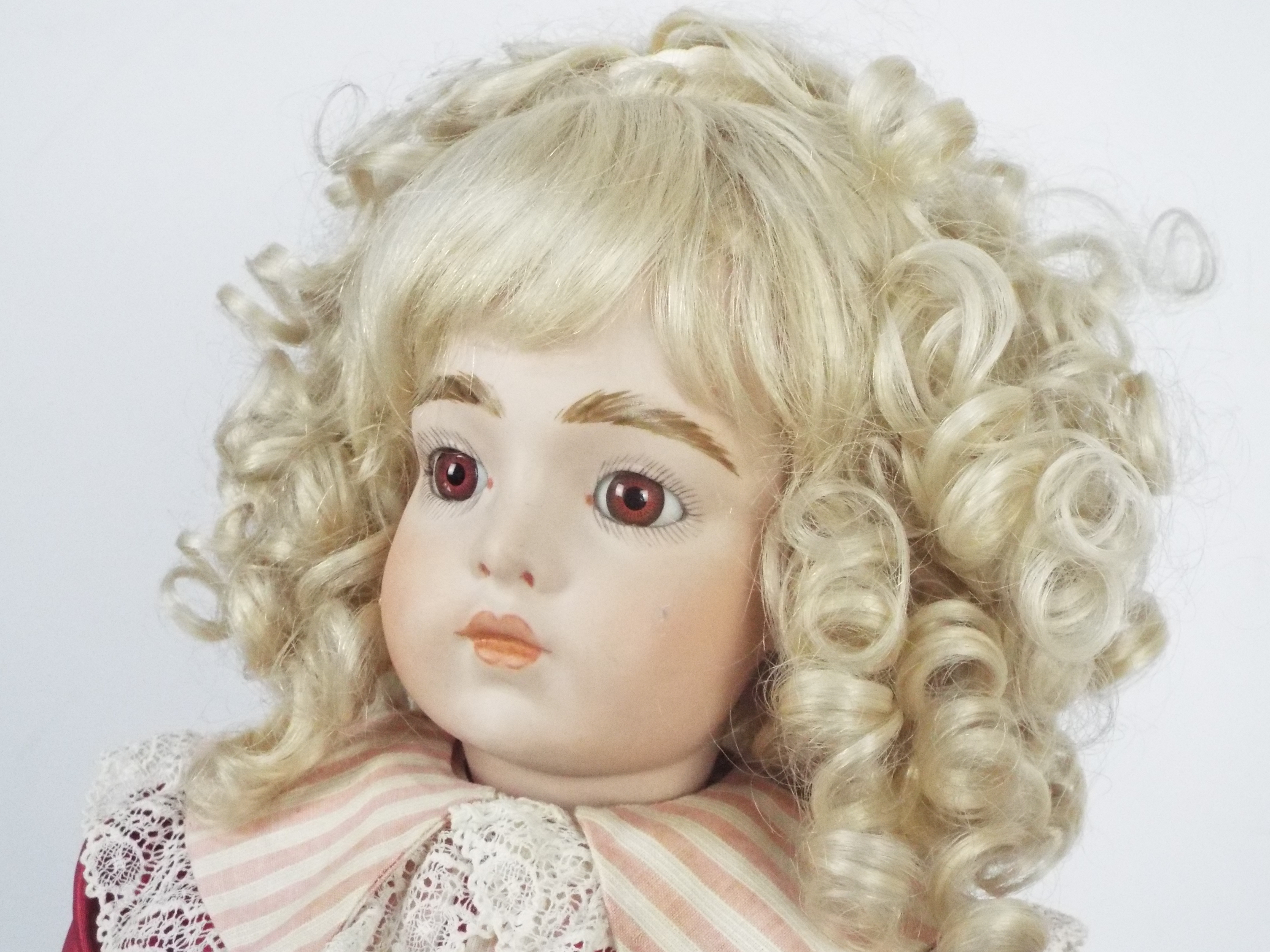 Bru Jne - A reproduction of a Bru Jne bisque head doll on stand. - Image 3 of 13