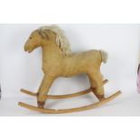 An unconfirmed brand retro rocking horse with Maine and tail hair.