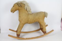 An unconfirmed brand retro rocking horse with Maine and tail hair.