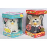 A collection of two Furby babies toys to include model 70-940 in white and #70665 In damaged box