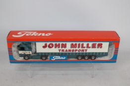 Tekno - A boxed Leyland DAF 95 Curtainsider in John Miller Transport livery in 1:50 scale.