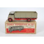 Dinky - A boxed Guy 4 Ton Lorry # 511 in fawn and red.