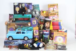 A large collection of Harry Potter Figures, Books, Board games, mugs and similar.
