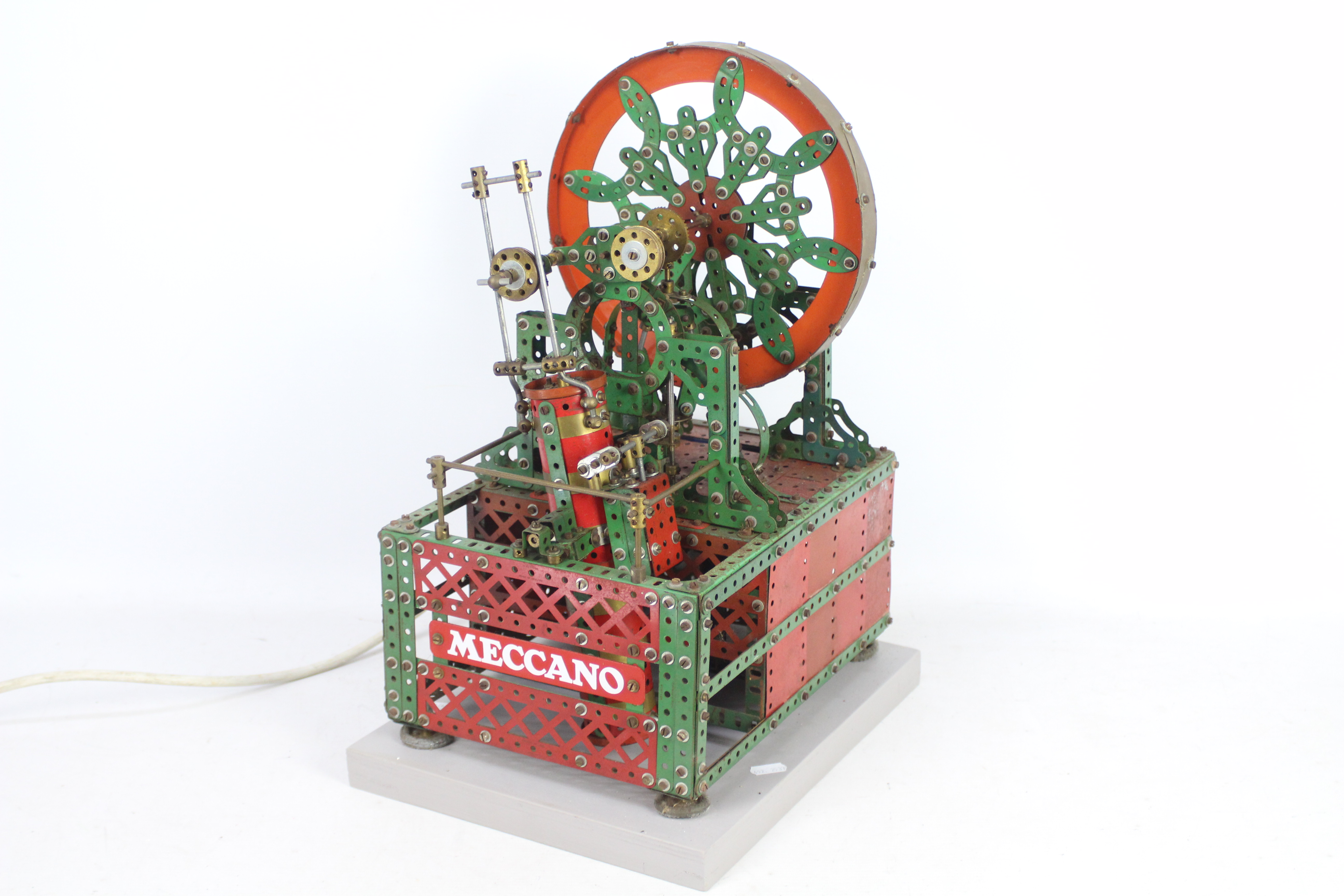Meccano - A vintage red and green Meccano shop display model of a Decorative Wheel.