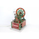 Meccano - A vintage red and green Meccano shop display model of a Decorative Wheel.