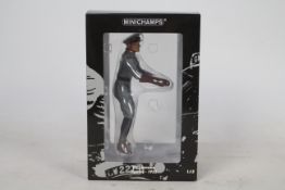 Minichamps - A boxed 1:12 scale T.E. Lawrence figurine in motorcycle riding position # 321350.