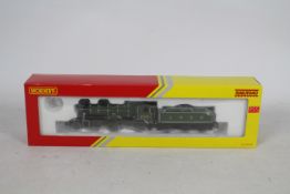 Hornby - A boxed OO gauge Hunt Class 4-4-0 loco named The Burton operating number 238 in LNER green