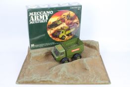 Meccano - A 1975 Meccano Shop Display Stand with a lorry and a factory sealed Army Multikit