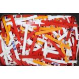Scalextric - A box full of Scalextric trackside barriers in red, white and yellow.
