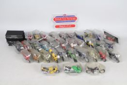 Maisto - 65 blister packed motorcycle models in 1:18 scale including a KTM Duke, Suzuki RM 250,