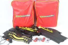 Scalextric - 2 x Micro Scalextric sets both contained in Micro Scalextric branded ruck sacks.