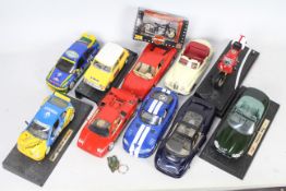 A collection of 1/18 scale model cars to include Burango Ferrari Testarossa 1984.