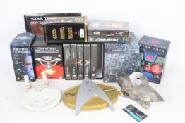 A collection of Star Wars and Star Trek VHS box sets to include - Star Wars Trilogy - Star Trek