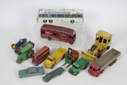 Dinky Toys - An unboxed collection of 12 Dinky Toys,