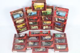 Matchbox Models of Yesteryear - 31 Matchbox MOYs housed in maroon window boxes.