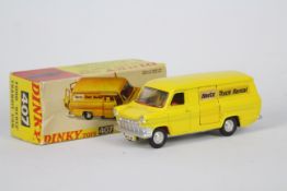 Dinky - A boxed 1970s Dinky # 407 Ford Transit Mk1 in Hertz yellow livery with a silver base.