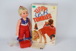 Tippy Tumbles - A dressed Tippy Tumbles doll with remote,