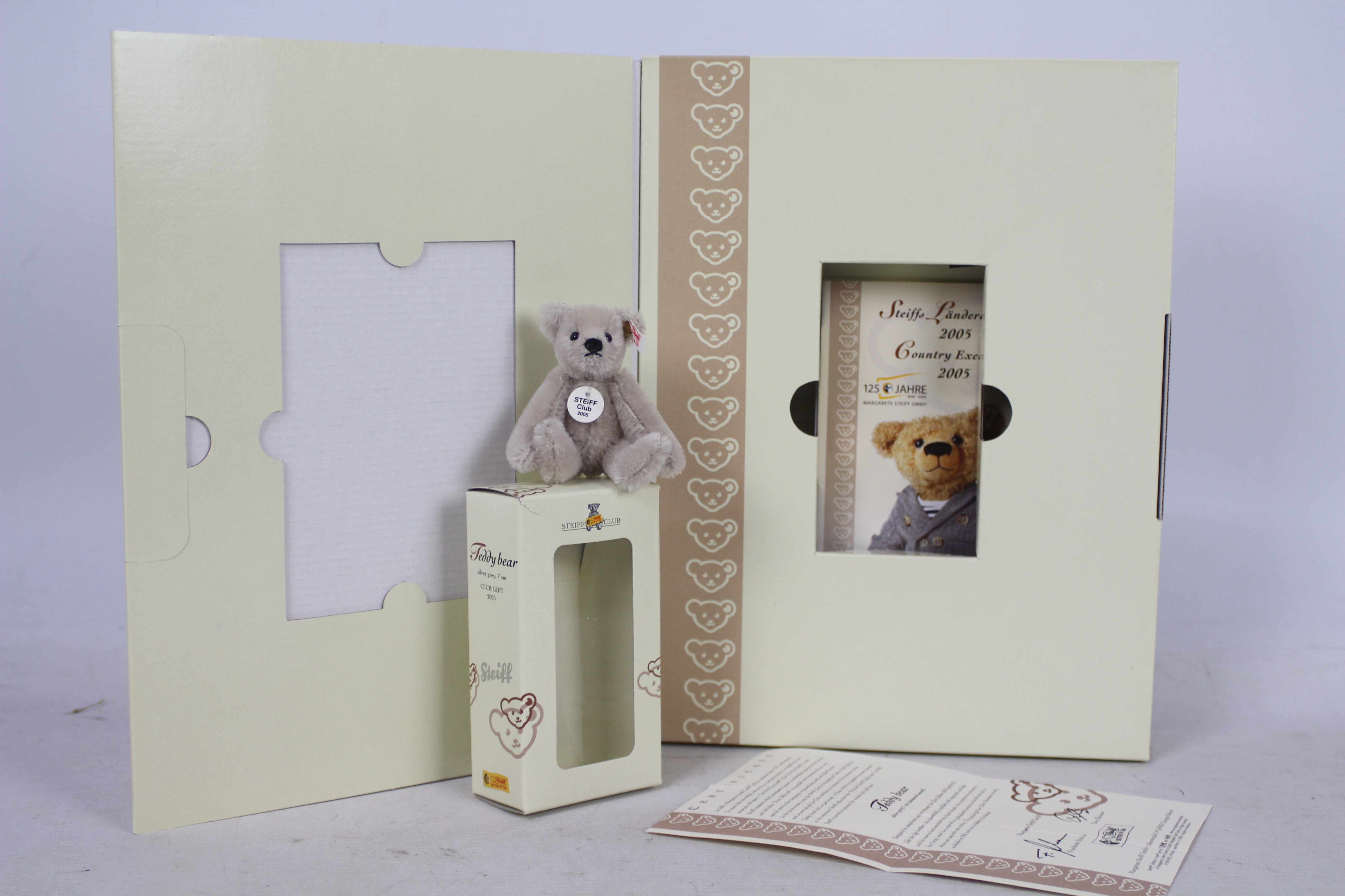 Steiff - A boxed miniature mohair 'Annual Gift 2005' bear - The silver grey bear has plastic eyes,