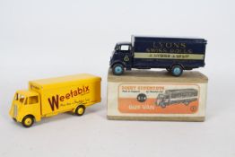 Dinky - 2 x restored Guy Vans # 514, one in Weetabix livery and one in Lyons Swiss Rolls livery.
