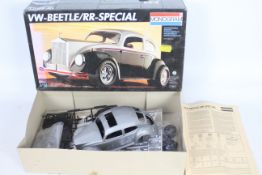 Monogram - A boxed 1:16 scale model car kit - Lot is a #77007 VW-Beetle/RR-Special.