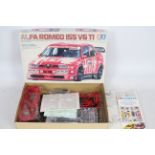 Tamiya - A boxed 1:24 scale model sports car kit - Lot is a #24137 Alfa Romeo I55 V6 TI.