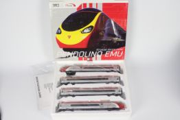 Dapol - A boxed OO gauge Virgin Pendolino set # D390-1.