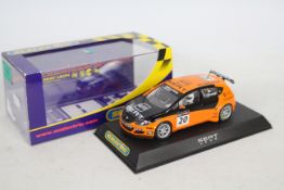 Scalextric - A boxed die-cast race car - Lot includes a #C2762 orange-coloured Seat Leon die-cast