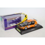 Scalextric - A boxed die-cast race car - Lot includes a #C2762 orange-coloured Seat Leon die-cast