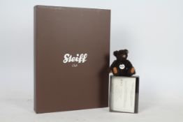 Steiff - A boxed miniature alpaca 'Annual Gift 2011' bear - The brown bear has plastic eyes,