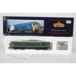 Bachmann - A boxed OO gauge Class 24 diesel loco in BR dark green livery operating number D5054.