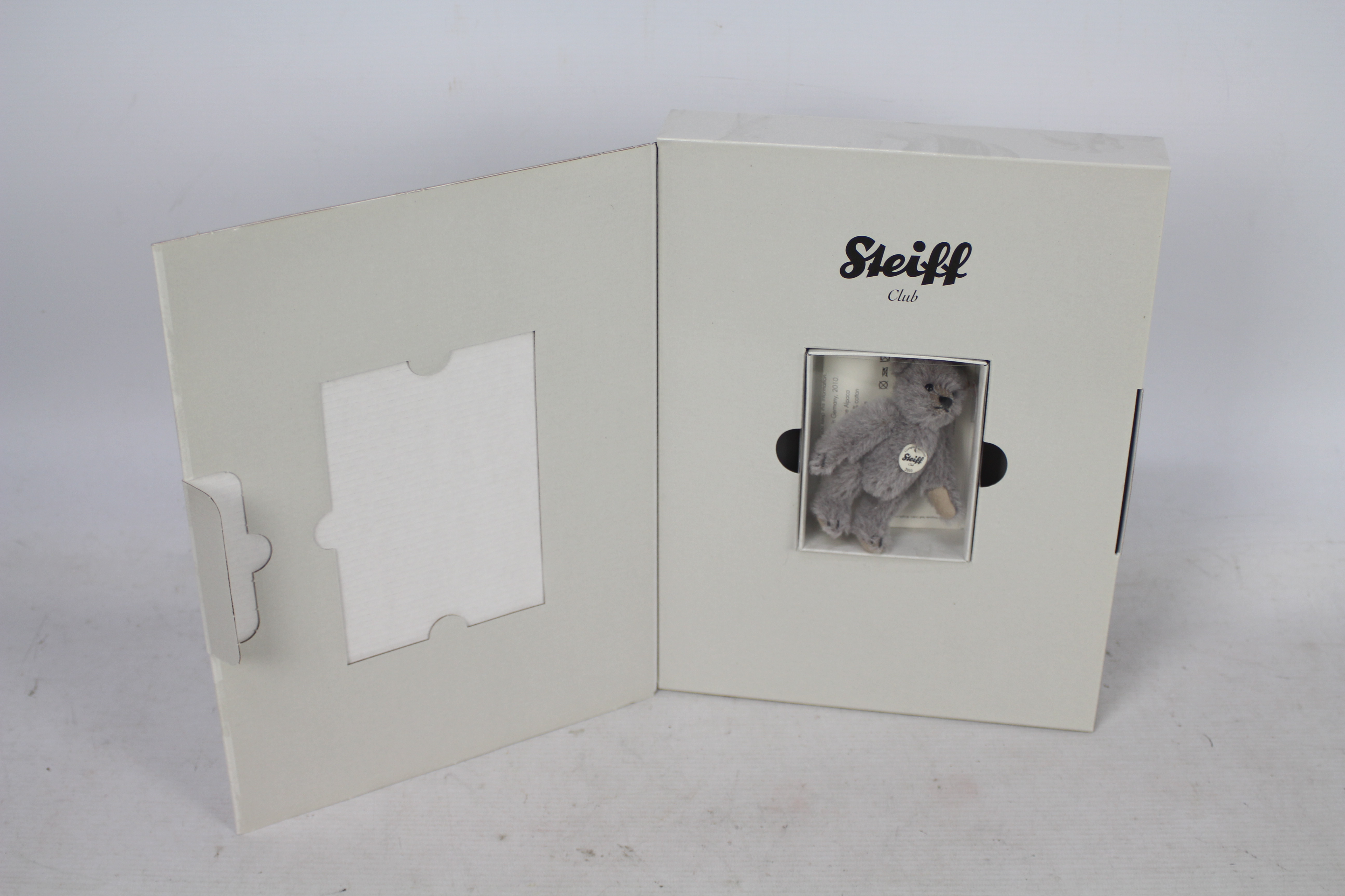 Steiff - A boxed miniature alpaca 'Annual Gift 2010' bear - The grey bear has plastic eyes, - Image 6 of 6