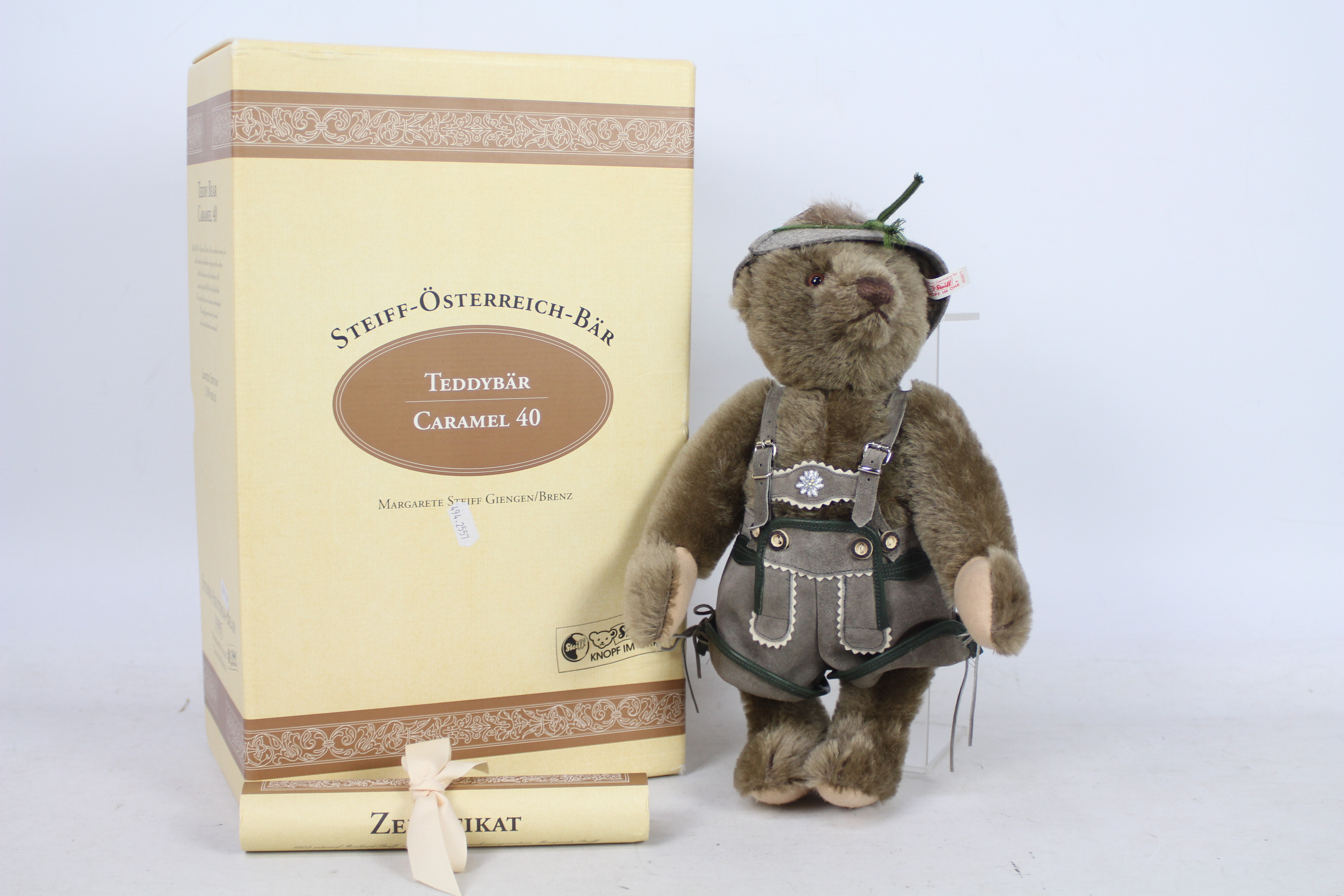 Steiff - A boxed grey mohair #00679 'Austria bear 1995 Caramel 40' - The bear has plastic eyes,