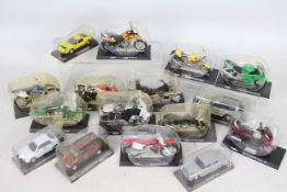 Maisto - A quantity of 16 x mostly Maisto die-cast model vehicles in plastic cases - Lot includes a