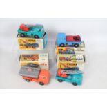 NN Toys - A collection of 4 boxed Bedford TK friction drive trucks, a Cement Tipper # 503,