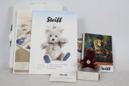 Steiff - A boxed miniature alpaca hair 'Annual Gift 2012' bear - The burgundy bear has plastic eyes,