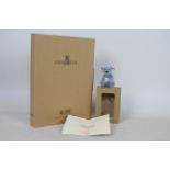 Steiff - A boxed miniature mohair 'Annual Gift 2004' bear - The light blue bear has plastic eyes,