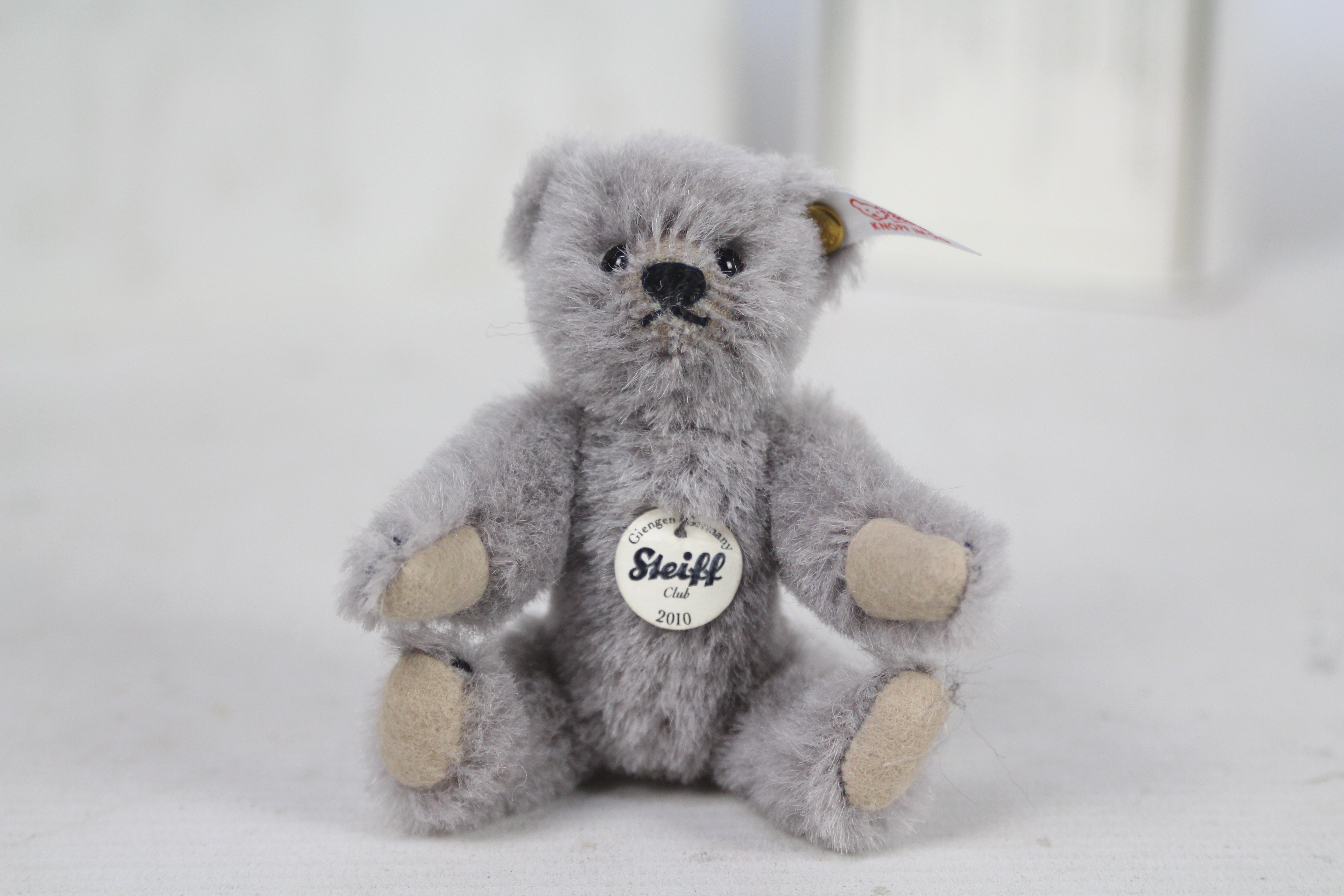 Steiff - A boxed miniature alpaca 'Annual Gift 2010' bear - The grey bear has plastic eyes, - Image 2 of 6