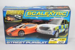 Scalextric - A boxed Street Pursuit set # C1199 with Lamborghini Gallardo and Range Rover Police