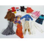 Sindy - A collection of 12 x items of vintage Sindy clothing and 4 pairs of shoes including a two