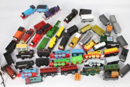 Tomy - Thomas & Friends. An excess of 30 plastic model trains (battery powered) and carriages.